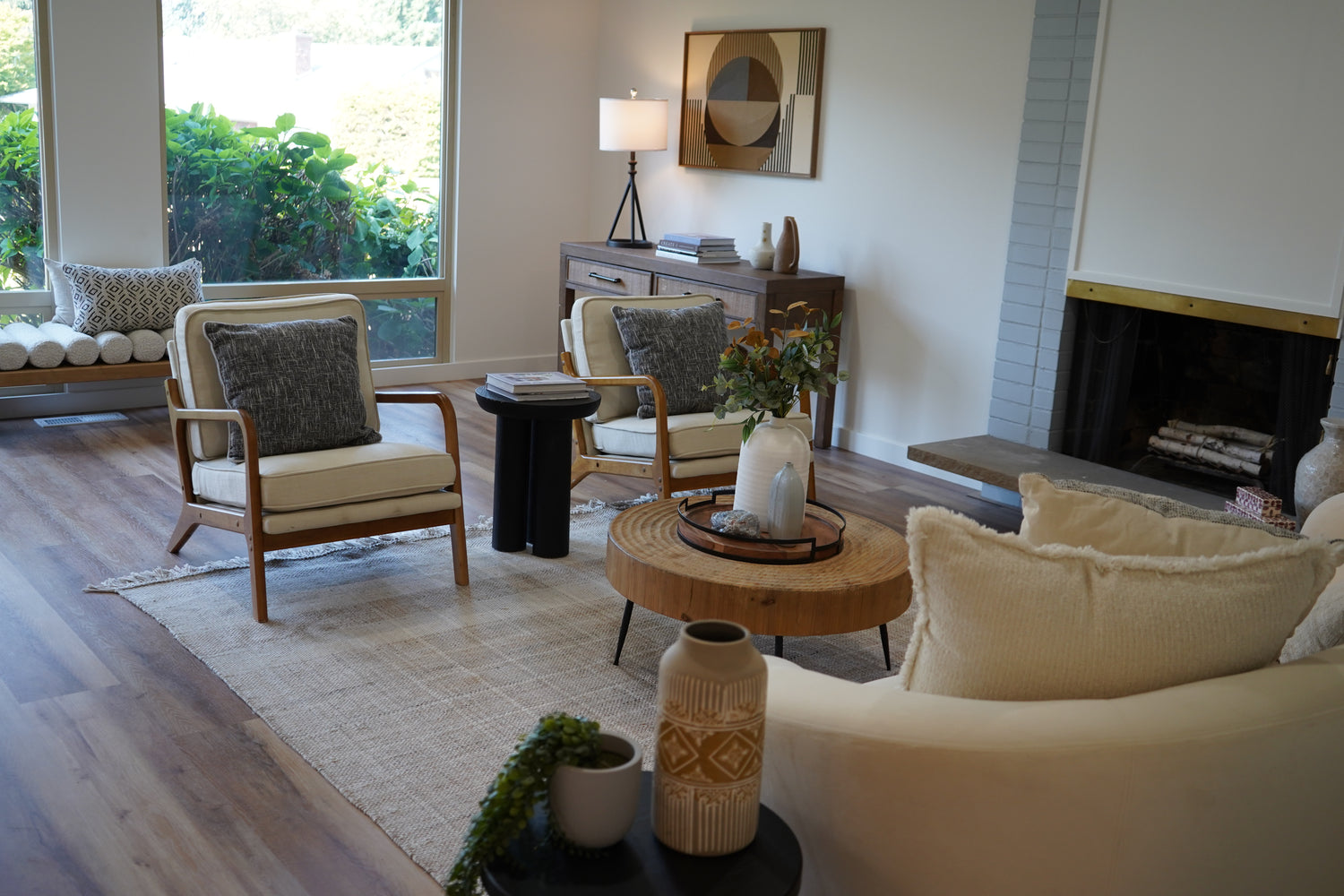 Living room with a couch, chairs, coffee table, and decorative items.