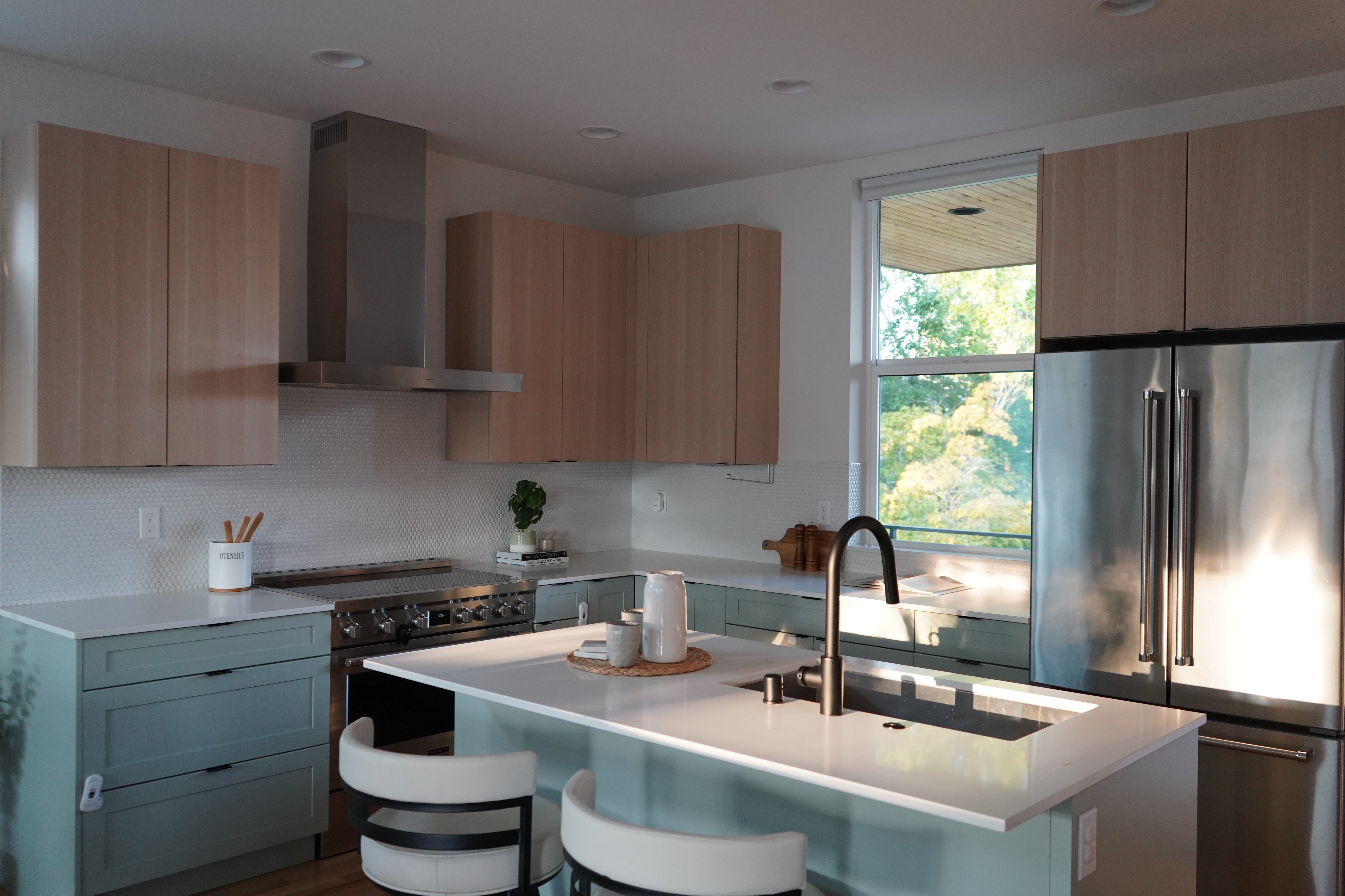 Modern kitchen with stainless steel appliances and wooden cabinets
