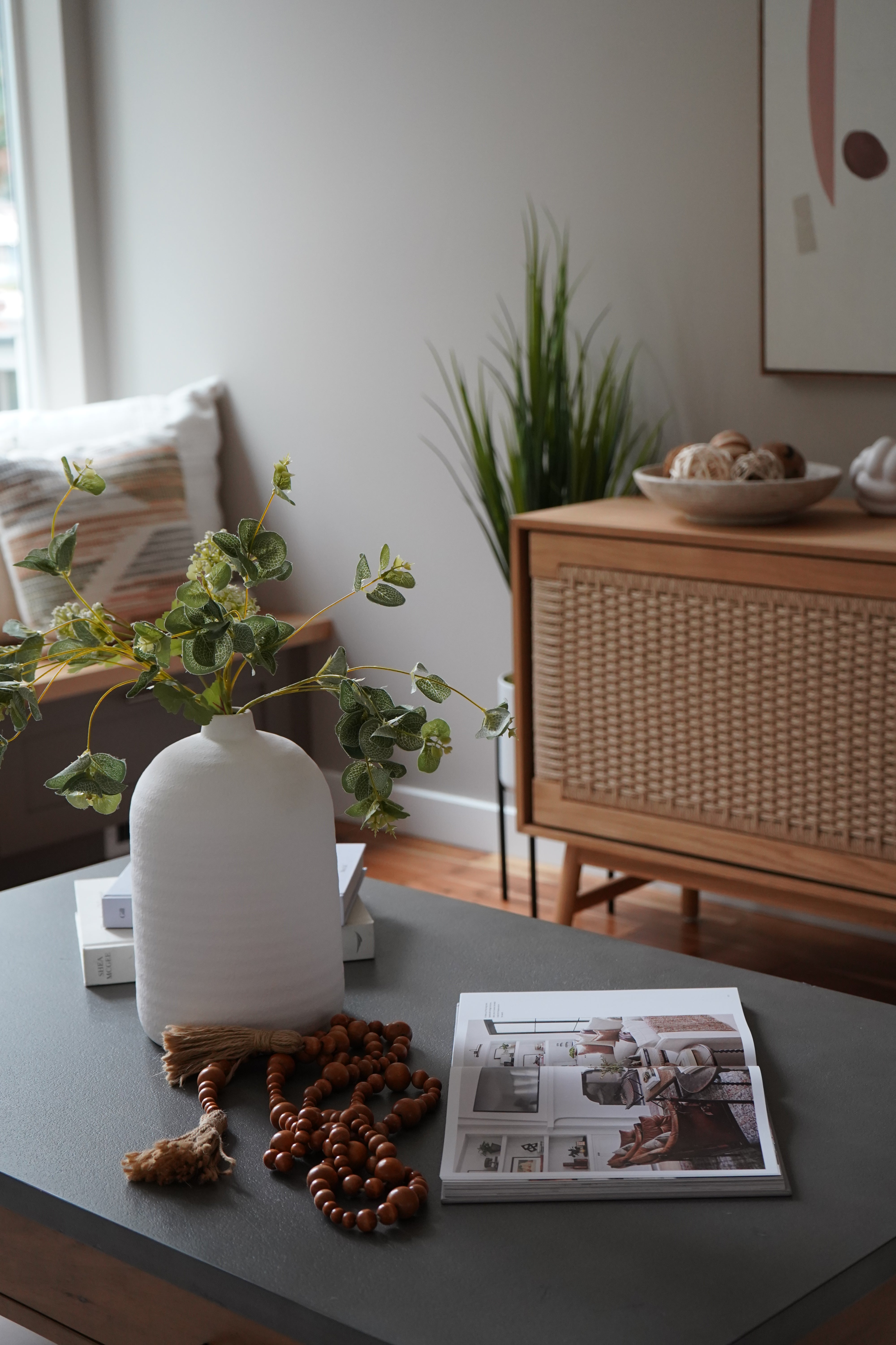 Dining area with a chair, table, and decor elements.